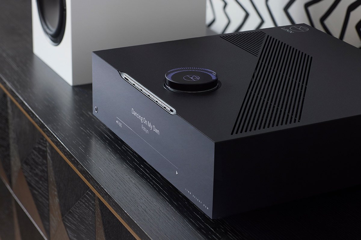 Linn Selekt DSM on a sideboard beside a loudspeaker